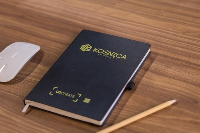 Yellow Košnica branding and signage at the coworking space